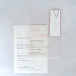 Sarah transparent vellum wedding invite with blush pink name tag and teardrop paperclip and details card for menu options