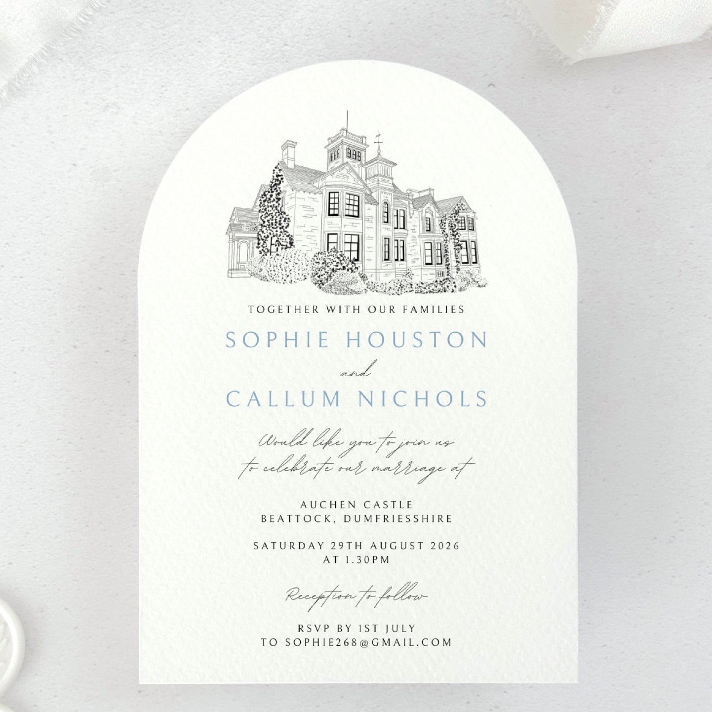 Arch shaped wedding invite with venue illustration of Auchen Castle, Dumfries & Galloway