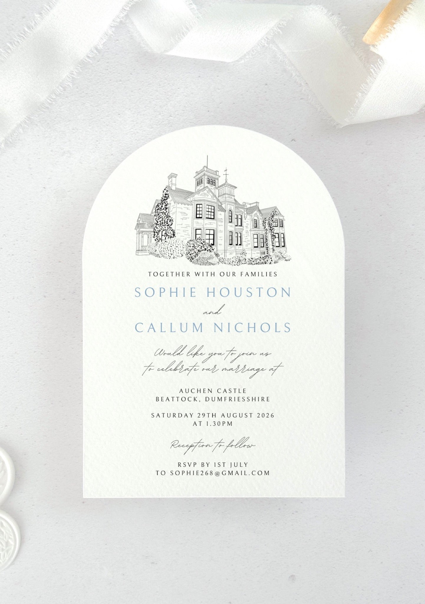 Arch shaped wedding invite with venue illustration of Auchen Castle, Dumfries & Galloway