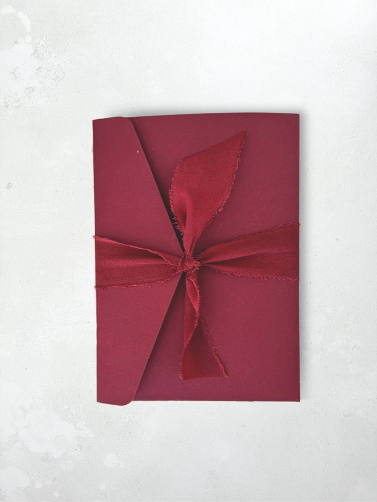 burgundy Zoe pocketfold wedding invite with silk tied ribbon handmade by zara scotland