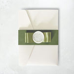 zoe sage green satin double bow and wax seal pocketfold wedding invite with belly band